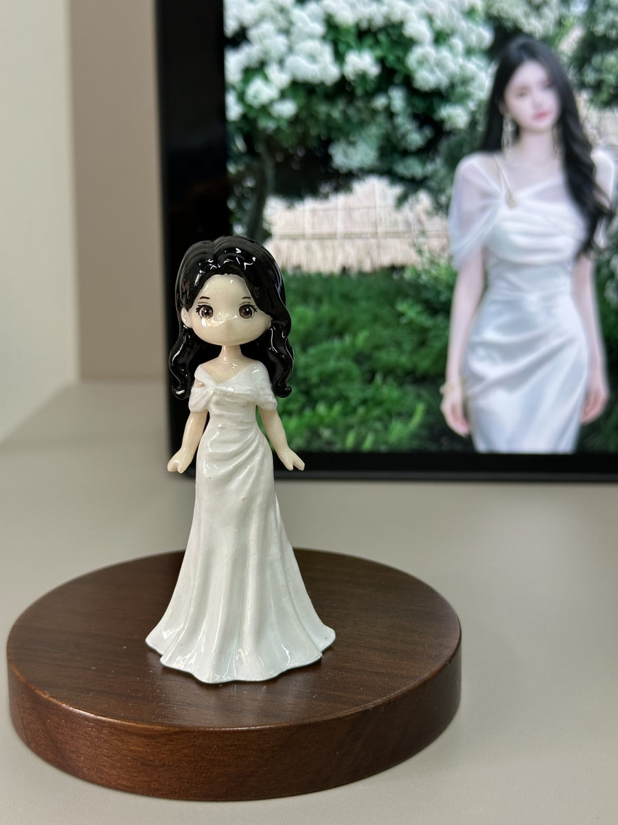Finished custom portrait figurine shown with its person reference photo